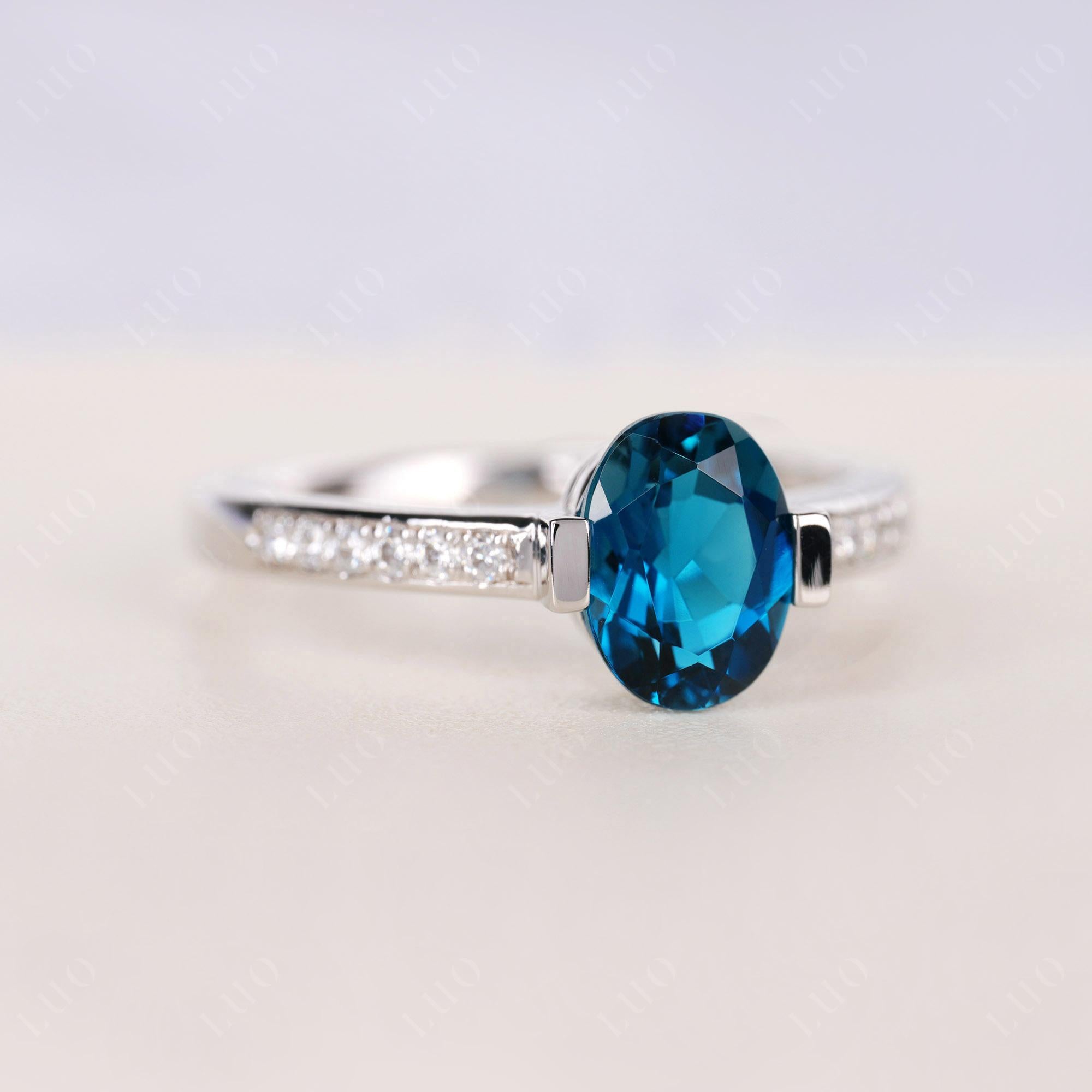 Oval London Blue Topaz Engagement Ring Half Bezel Set | LUO Jewelry