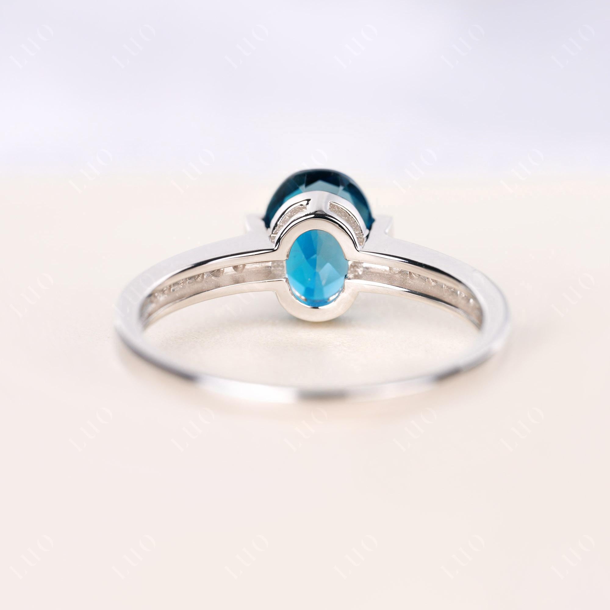 Oval London Blue Topaz Engagement Ring Half Bezel Set | LUO Jewelry