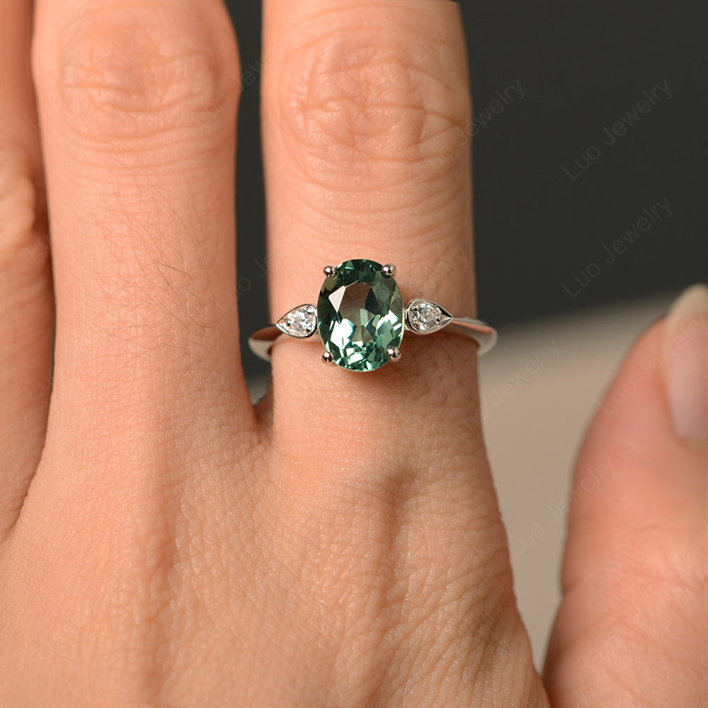 Oval green deals sapphire ring